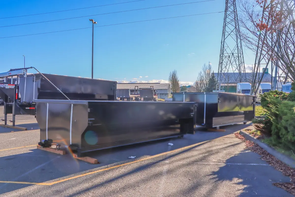 Roll-off dumpster ready for waste disposal at job site for Concrete Dumpster Rental in Yukon